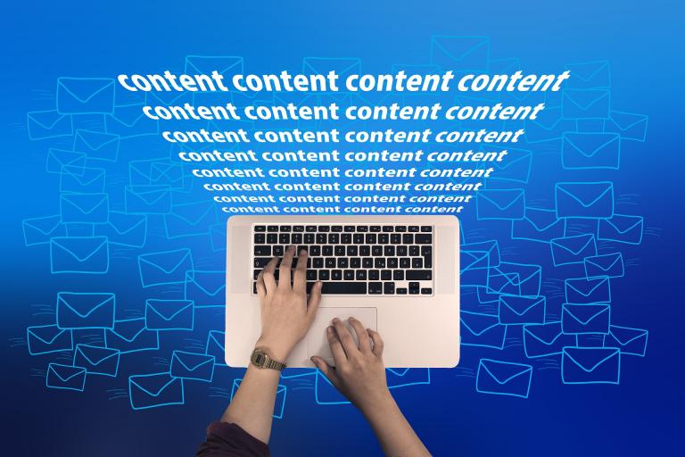 Content graphic with laptop and hands against blue background